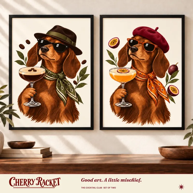 Styled room mockup showing Dachshund Espresso Martini and Dachshund Pornstar Martini prints together. Frames not included.